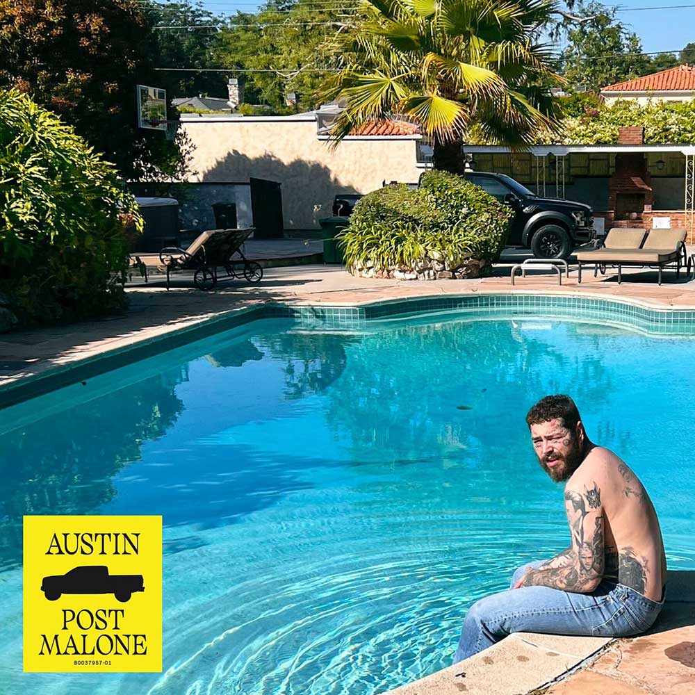 Post Malone sitting next to pool